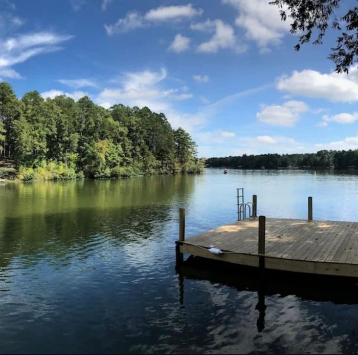 Private dock reaching over the calm water of Lake Coronado