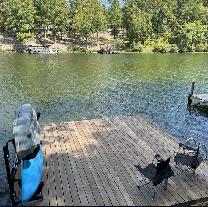Kayaks on the private dock at the water's edge