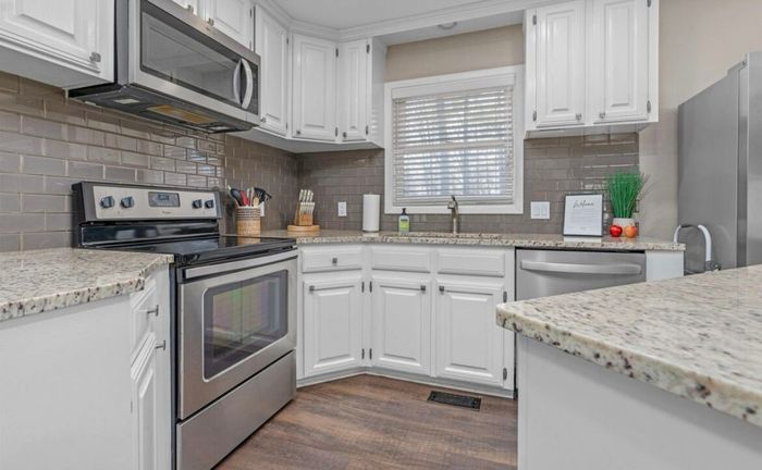 Range and prep space in the well-equipped kitchen