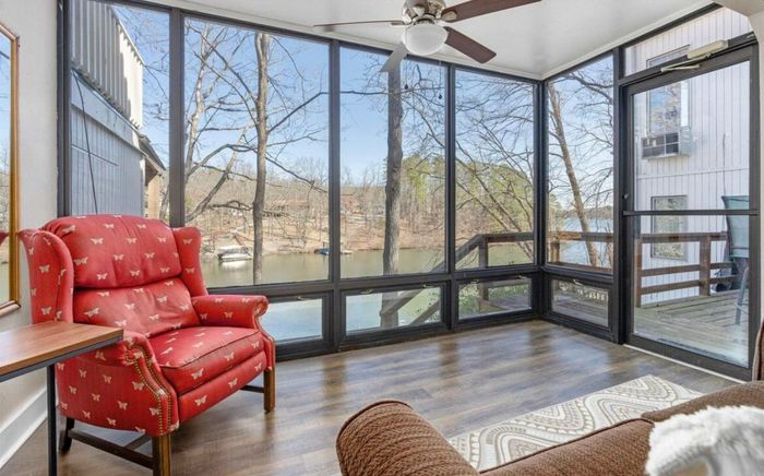 Lower level sunroom with lake views and dock access
